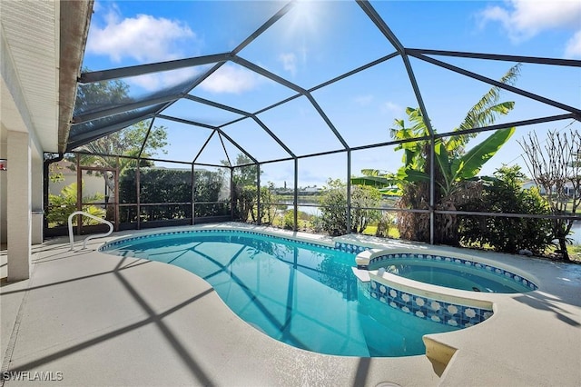 view of swimming pool featuring an in ground hot tub, a lanai, and a patio area