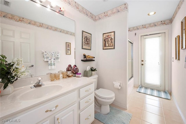 full bathroom featuring tile patterned flooring, vanity, bath / shower combo with glass door, and toilet