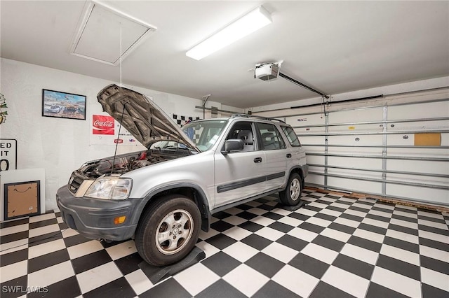 garage featuring a garage door opener