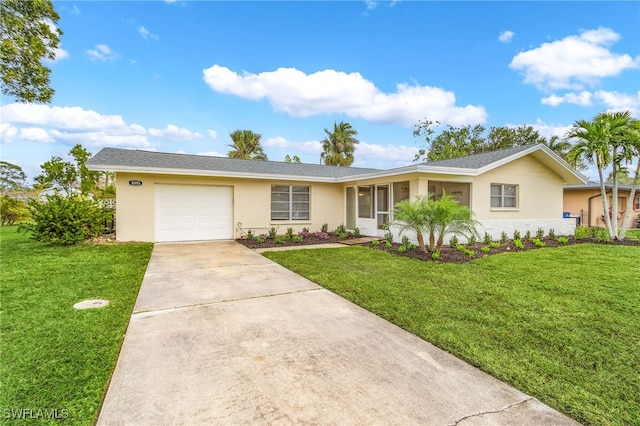 single story home featuring a garage and a front lawn