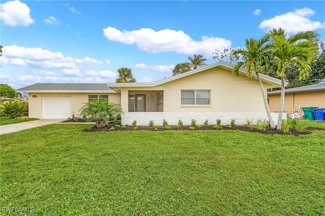 single story home featuring a garage and a front lawn