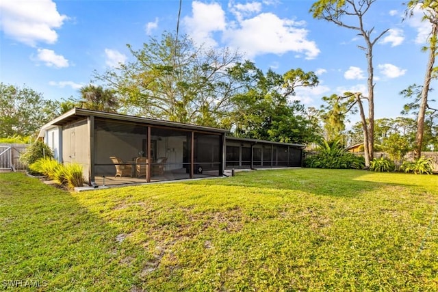 view of yard featuring a sunroom