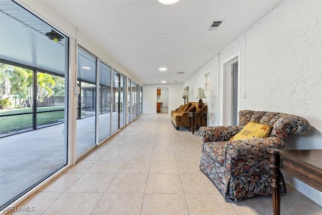 hallway with light tile patterned flooring