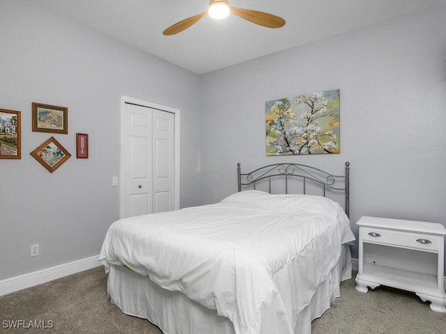 bedroom with ceiling fan, a closet, and carpet