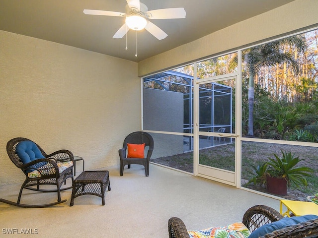 sunroom / solarium with ceiling fan