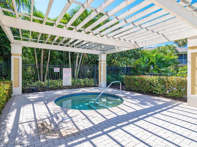 view of pool with a hot tub, a pergola, and a patio area