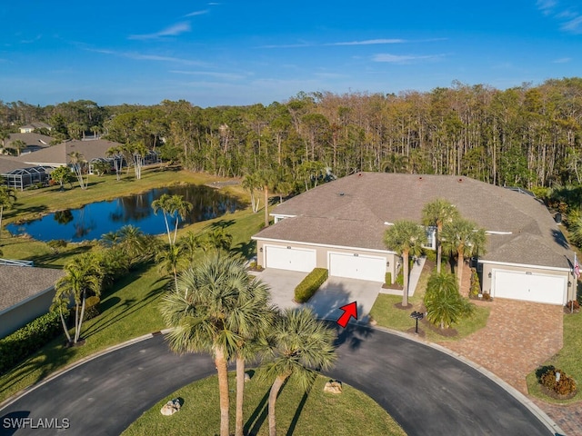 birds eye view of property with a water view