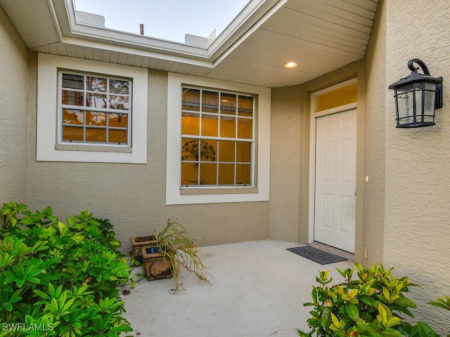 property entrance with a patio area