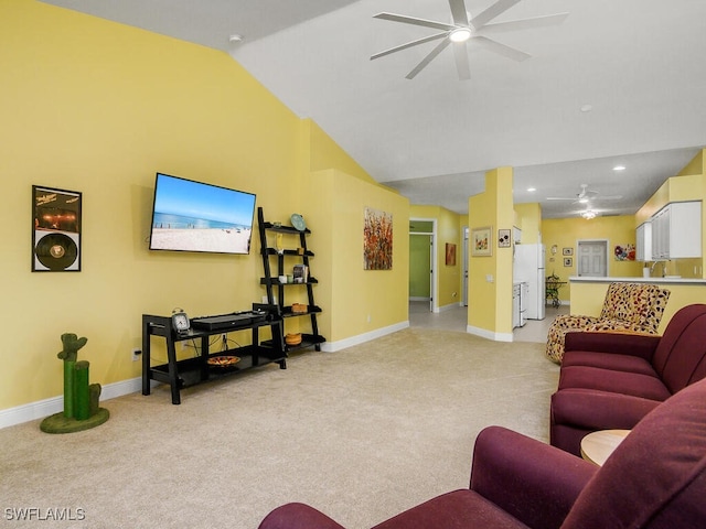 carpeted living room with high vaulted ceiling and ceiling fan