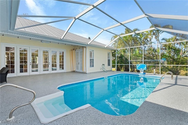 outdoor pool featuring a lanai and a patio area