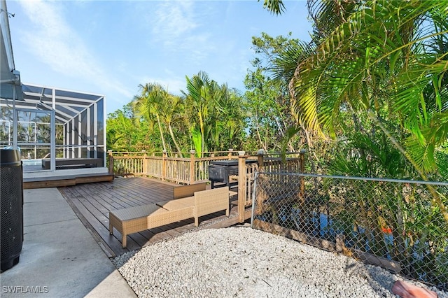 deck with a lanai and an outdoor hangout area