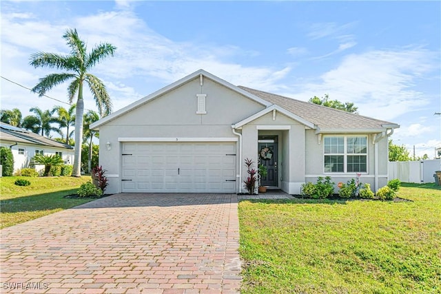 single story home with a garage and a front lawn