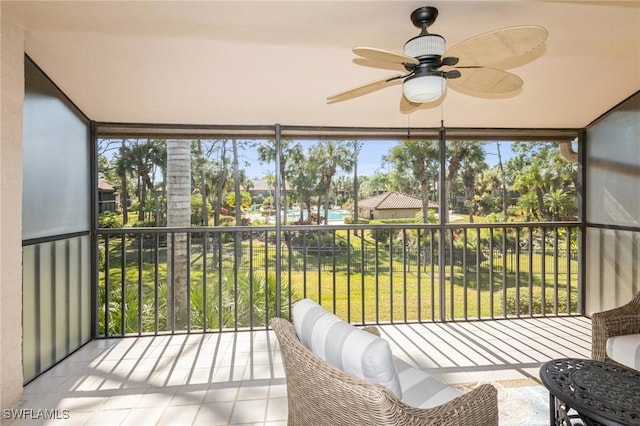 sunroom with ceiling fan and a wealth of natural light