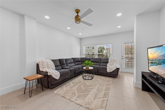 living area featuring ceiling fan, baseboards, and recessed lighting