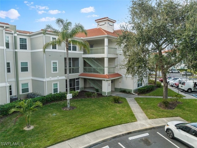 view of property with uncovered parking