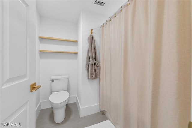 bathroom with baseboards, visible vents, toilet, and tile patterned floors