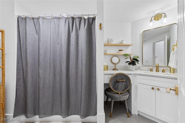 full bathroom with a shower with shower curtain, vanity, and tile patterned floors