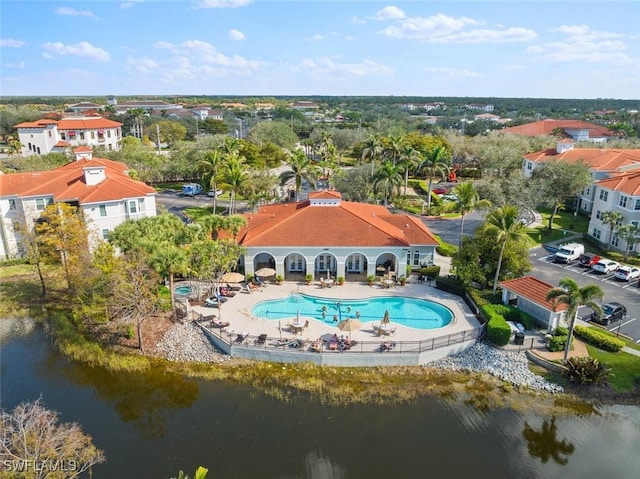 birds eye view of property with a water view