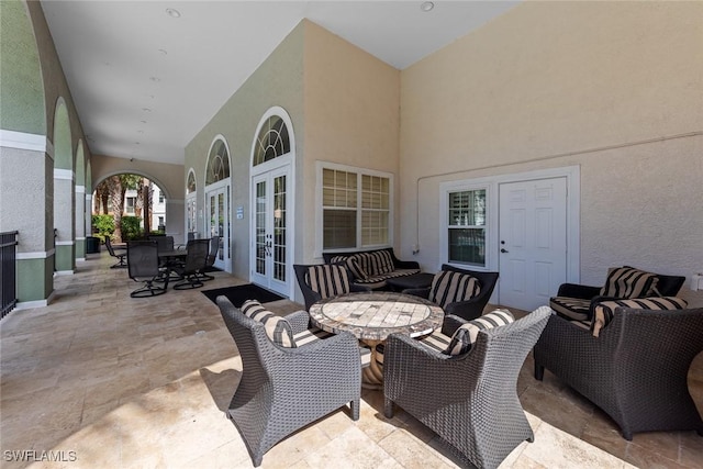 view of patio with french doors and outdoor dining space