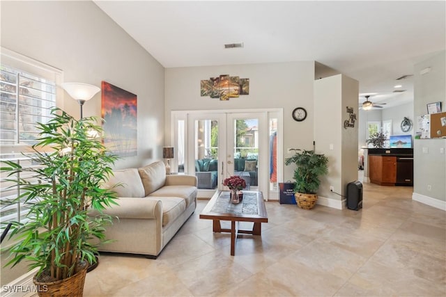 living room featuring a wealth of natural light and french doors