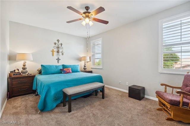 bedroom with ceiling fan and light colored carpet