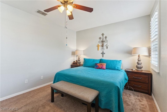 bedroom with light colored carpet and ceiling fan