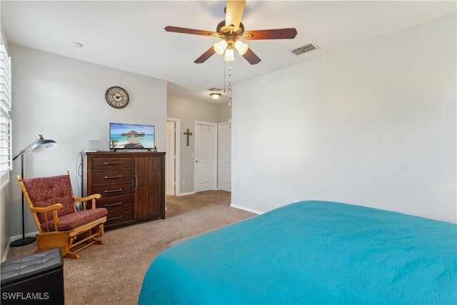 bedroom featuring light colored carpet and ceiling fan