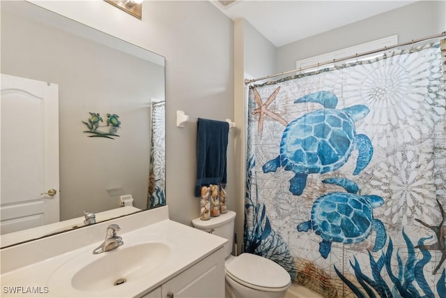 bathroom featuring vanity and toilet