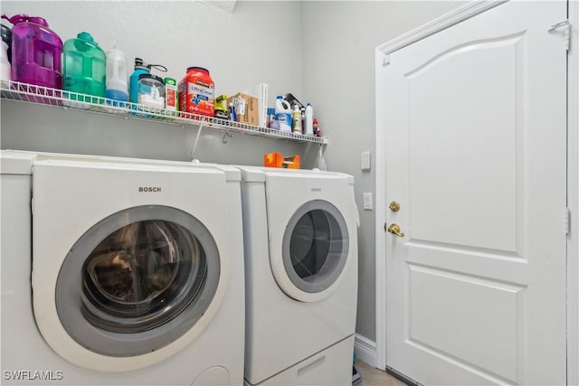 clothes washing area featuring washing machine and clothes dryer