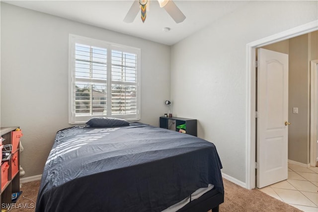 bedroom with ceiling fan and light colored carpet