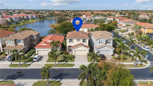 birds eye view of property featuring a water view