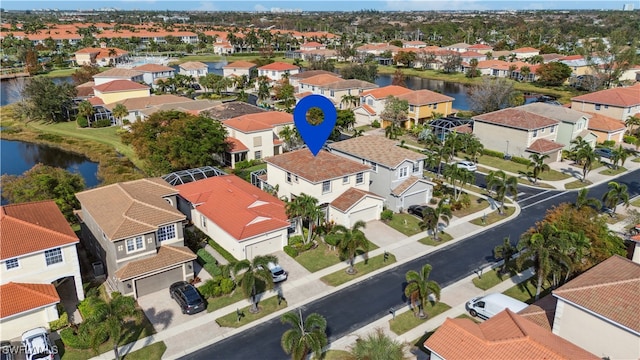 birds eye view of property featuring a water view