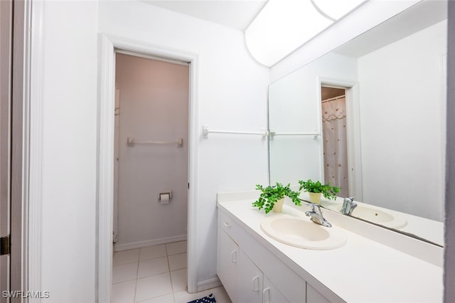 bathroom with vanity and tile patterned flooring