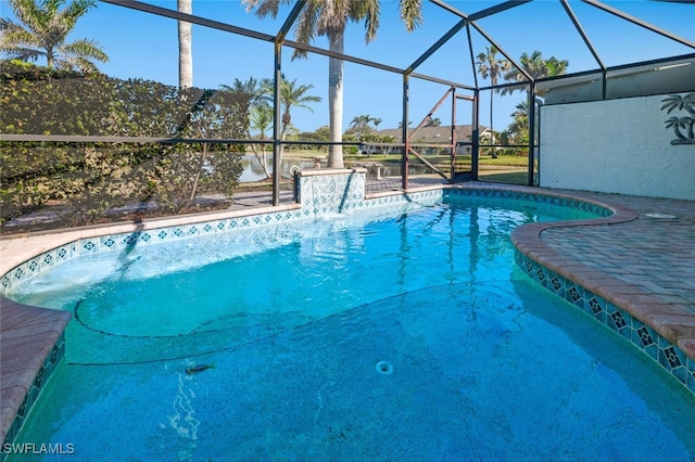 view of swimming pool with a lanai