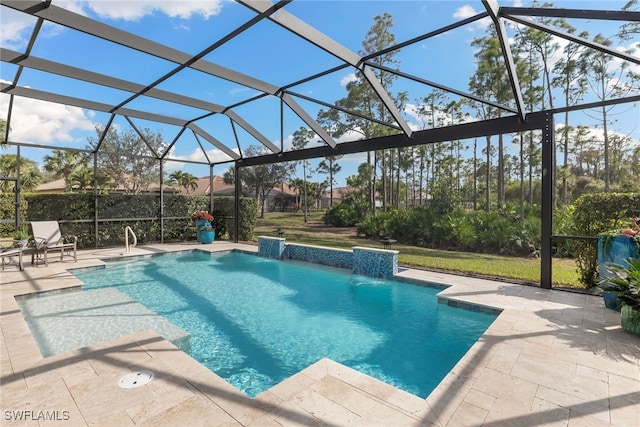 view of pool with a lanai and a patio