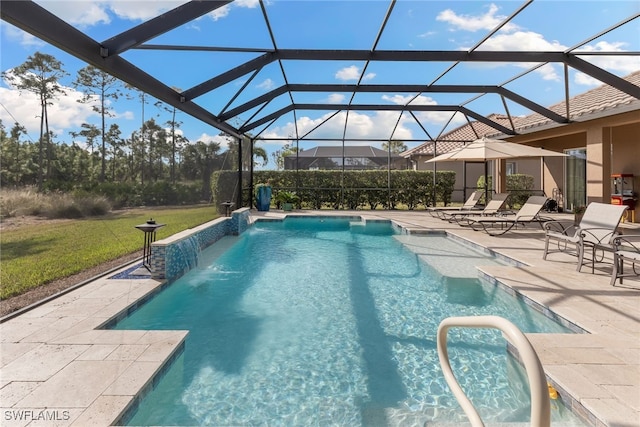 view of pool with pool water feature, a yard, a patio area, and glass enclosure