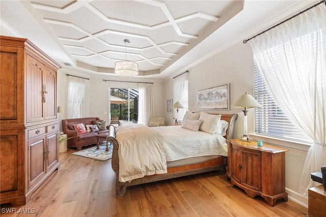 bedroom with coffered ceiling, a notable chandelier, access to outside, and light wood-type flooring