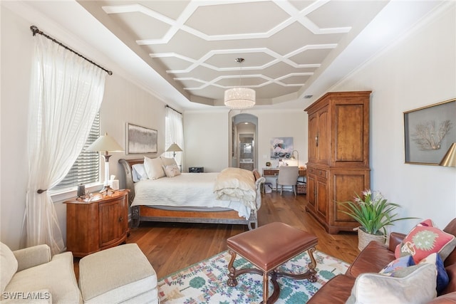 bedroom with coffered ceiling and light hardwood / wood-style flooring