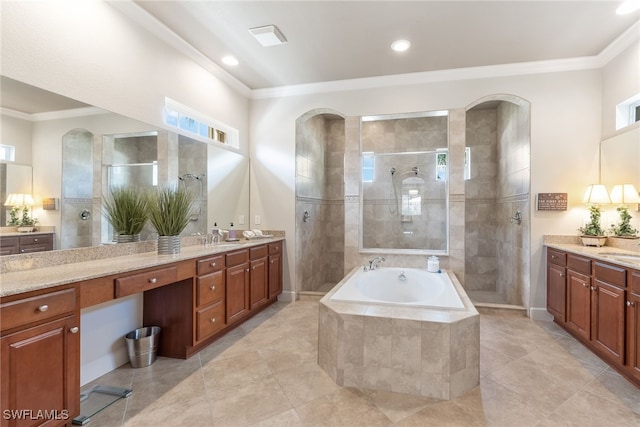 bathroom featuring ornamental molding, separate shower and tub, and vanity