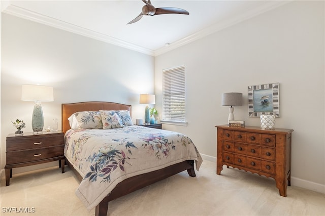 carpeted bedroom featuring crown molding and ceiling fan