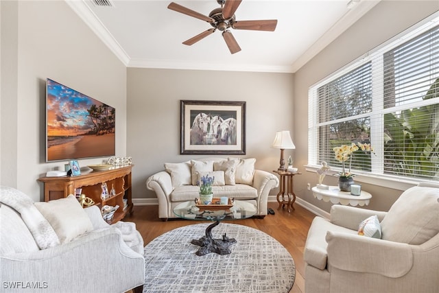 living room featuring crown molding, ceiling fan, and wood-type flooring