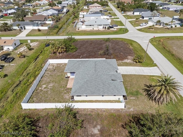 birds eye view of property with a residential view