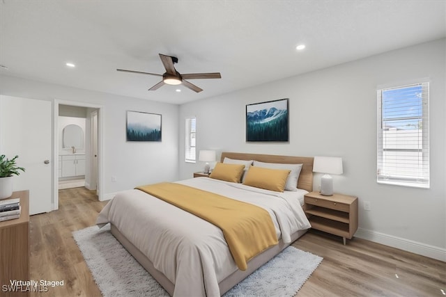 bedroom featuring light wood-style flooring, baseboards, and recessed lighting