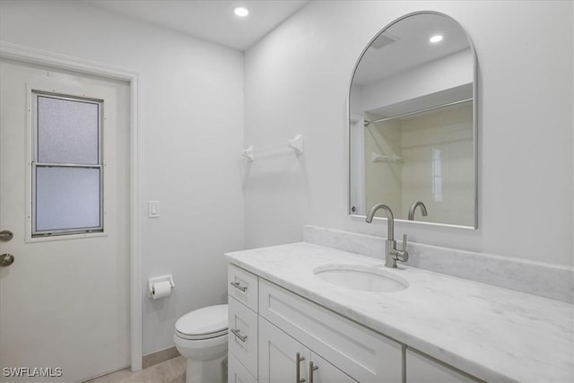 full bathroom with recessed lighting, vanity, and toilet