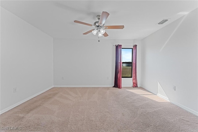 unfurnished room featuring light carpet and ceiling fan