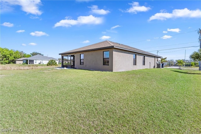 view of side of home featuring a yard