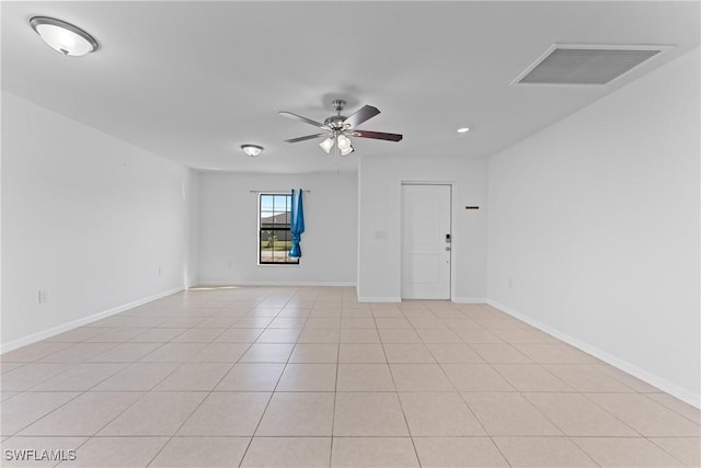 unfurnished room featuring light tile patterned flooring and ceiling fan