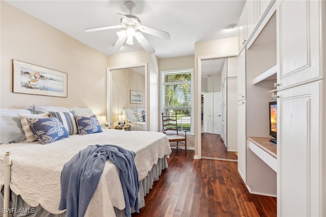 bedroom with dark wood-style floors, ceiling fan, and baseboards