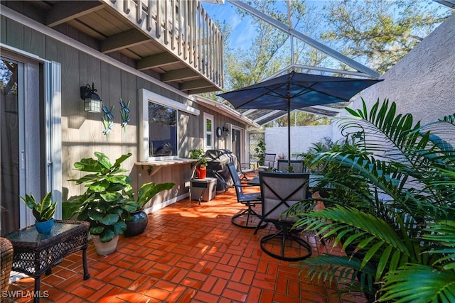 view of patio with a lanai