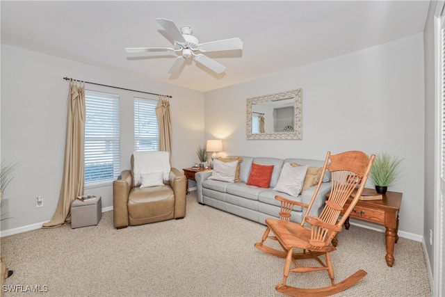 carpeted living room with ceiling fan